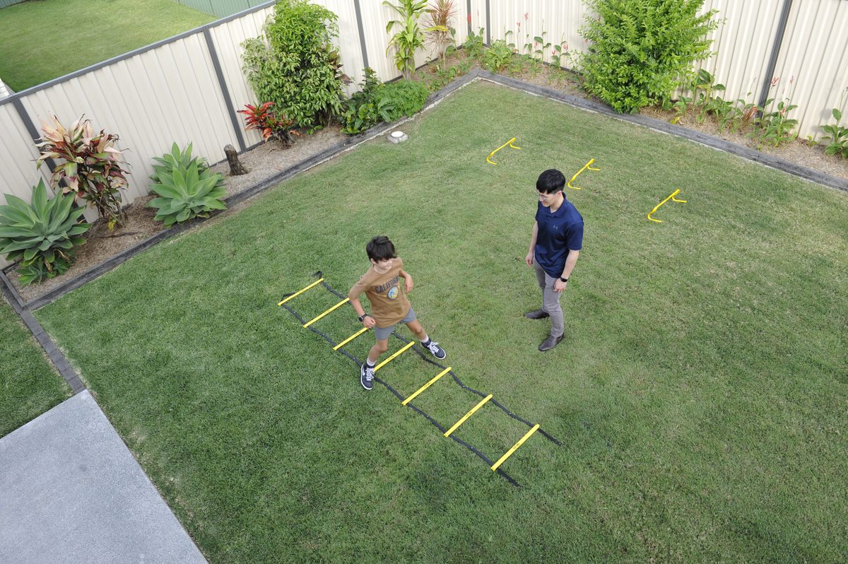 Physiotherapist guiding a client through a balance exercise