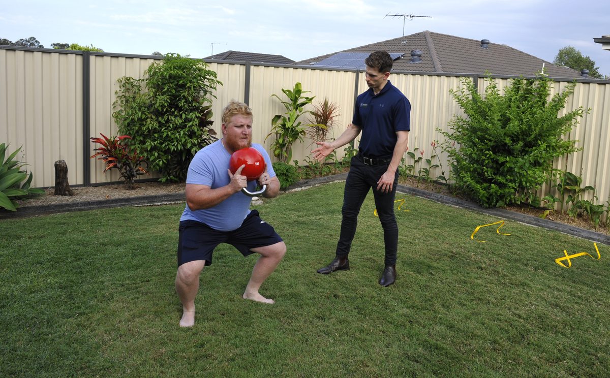 Physiotherapist providing hands-on musculoskeletal treatment
